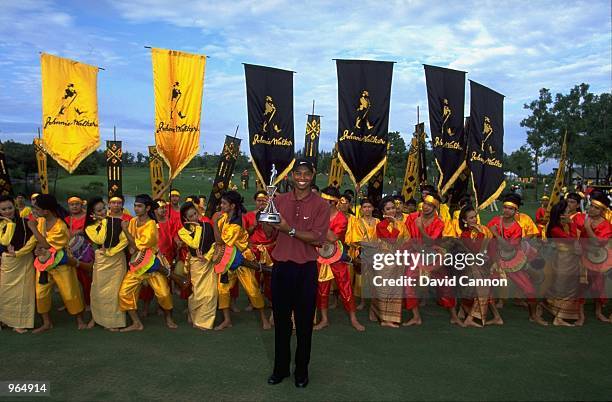 Tiger Woods of USA holds the trophy aloft after winning the Johnnie Walker Classic played at the Alpine Golf and Sports Club in Bangkok, Thailand. \...