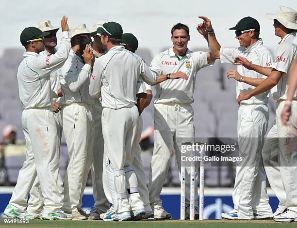 Dale Steyn of South Africa celebrates the wicket of S. Badrinath of India for 56 runs during the day 3 of the 1st test between India and South Africa...