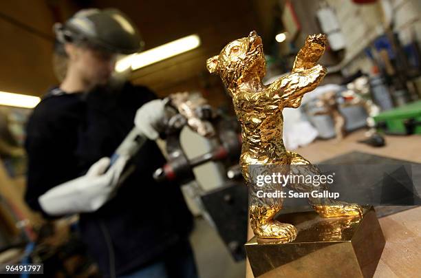Finished Berlinale Golden Bear stands on the worktable of metal crafts worker Christiane Reum at the Hermann Noack casting foundry on February 8,...