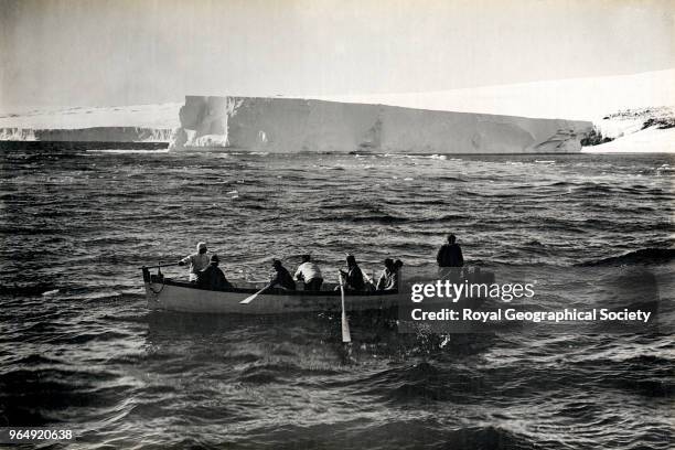 Berg aground near Cape Evans - boat coming off - Terra Nova aground, Antarctica, 20th January 1911. British Antarctic Expedition 1910-1913.