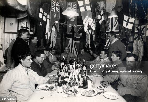 Midwinter Day Dinner, On board Terra Nova British Antarctic Expedition 1910-1913, Antarctica, 22nd June 1911. British Antarctic Expedition 1910-1913.