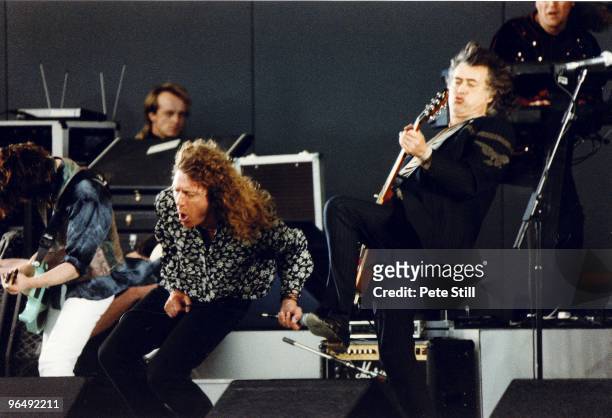 Robert Plant of Led Zeppelin is joined on stage by Jimmy Page at The Silver Clef Award Winners Concert 'Knebworth '90', on JUNE 30th, 1990 in...