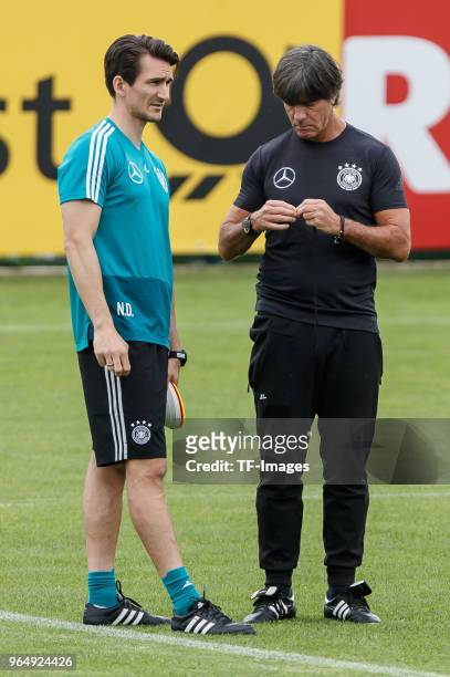 Fitness coach Nicklas Dietrich of Germany speaks with Head coach Jochaim Loew of Germany during the Southern Tyrol Training Camp day two on May 24,...