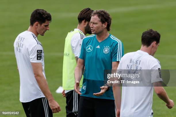 Mario Gomez of Germany speaks with Assistant coach Marcus Sorg of Germany during the Southern Tyrol Training Camp day two on May 24, 2018 in Bolzano,...