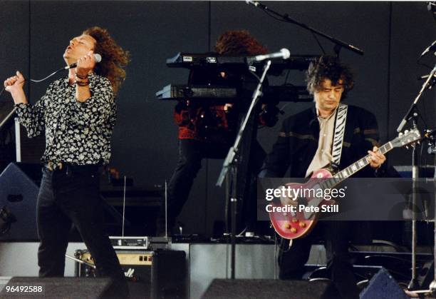 Robert Plant of Led Zeppelin is joined on stage by Jimmy Page at The Silver Clef Award Winners Concert 'Knebworth '90', on JUNE 30th, 1990 in...