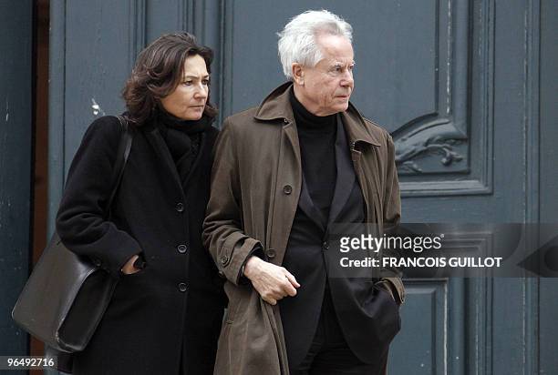 French actor Francois Marthouret and an unidentified person leave the Saint-Roch church following the funeral ceremony for French actor and theater...