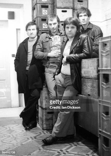Group portrait of English pub rock band Dr Feelgood backstage at Friars, Aylesbury, United Kingdom, 17th May 1975. L-R John Martin , Lee Brilleaux,...