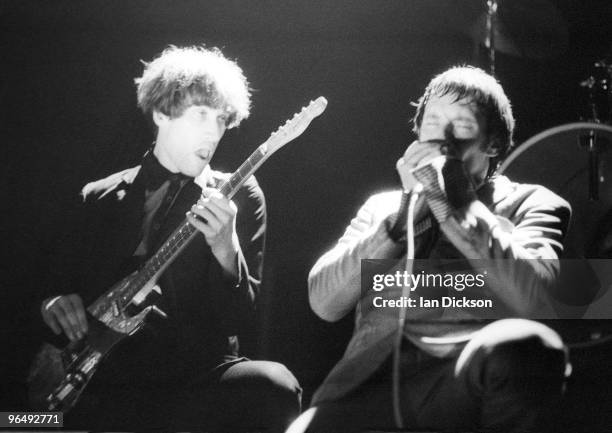 Wilko Johnson and Lee Brilleaux from Dr. Feelgood perform live on stage at Hammersmith Palais, London, 19th December 1976.