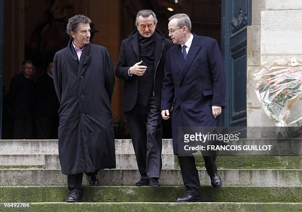 French former Culture ministers Jack Lang and Renaud Donnedieu de Vabres , with an unidentified person, leave the Saint-Roch church following the...