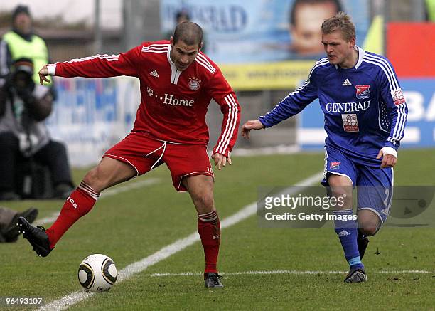 Deniz Yilmaz of Bayern II and Thorsten Schulz of Unterhaching battle for the ball during the 3.Liga match between SpVgg Unterhaching and Bayern...