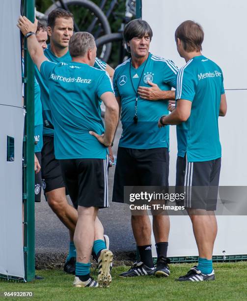 Assistant coach Thomas Schneider of Germany, Assistant coach Marcus Sorg of Germany, Head coach Jochaim Loew of Germany and Manager Oliver Bierhoff...