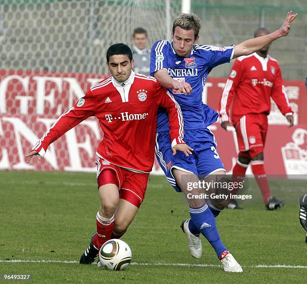 Mehmet Ekici of FC Bayern II and Benjamin Schwarz of Unterhaching battle for the ball during the 3.Liga match between SpVgg Unterhaching and Bayern...