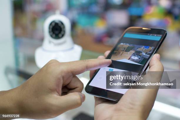 male hand press phone watch cctv - security camera view stock pictures, royalty-free photos & images