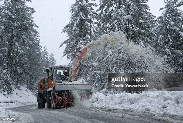 Snow cutter clears the road during a heavy snowfall on February 08, 2010 In Tangmarg about 40 kms 25 miles west of Srinagar, Kashmir, India. . At...