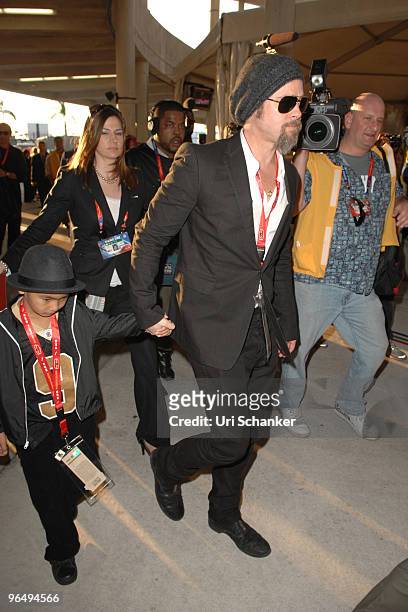 Brad Pitt and his son Maddox Jolie-Pitt arrive at Super Bowl XLIV at Sun Life Stadium on February 7, 2010 in Miami Gardens, Florida.