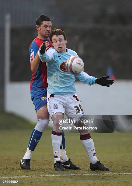 Kevin Thornton of Northampton Town attempts to control the ball under pressure from Mark Arber of Dagenham & Redbridge during the Coca Cola League...