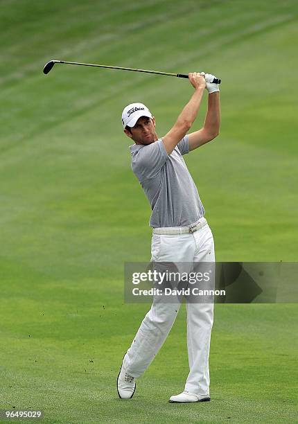 Gregory Bourdy of France plays his second shot at the 12th hole during the final round of the 2010 Omega Dubai Desert Classic on the Majilis Course...
