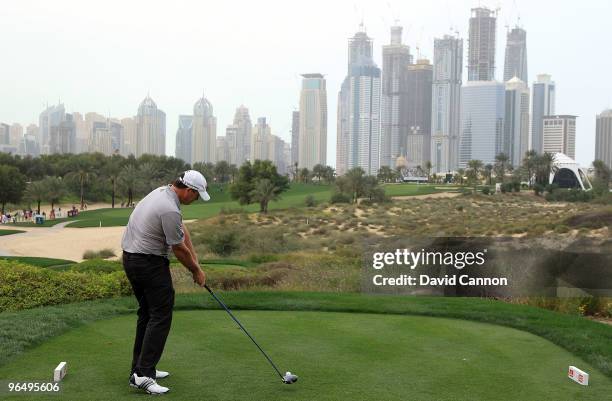 Marcus Fraser of Australia plays his tee shot at the 8th hole during the final round of the 2010 Omega Dubai Desert Classic on the Majilis Course at...