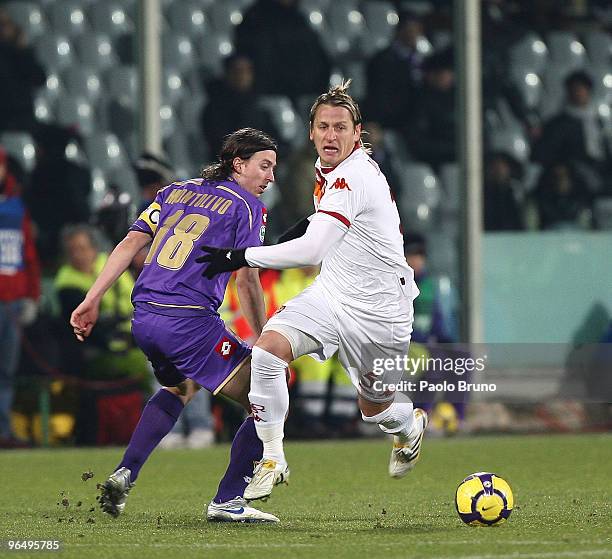 Philippe Mexes of AS Roma and Riccardo Montolivo of ACF Fiorentina in action during the Serie A match between Fiorentina and Roma at Stadio Artemio...
