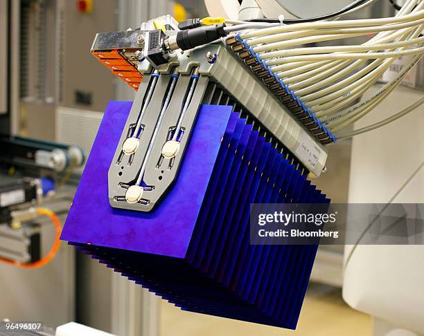 Machine sorts solar wafers to be used for solar panels at the Solarworld AG plant in Freiberg, Germany, on Monday, Feb. 8, 2010. Germany's solar...