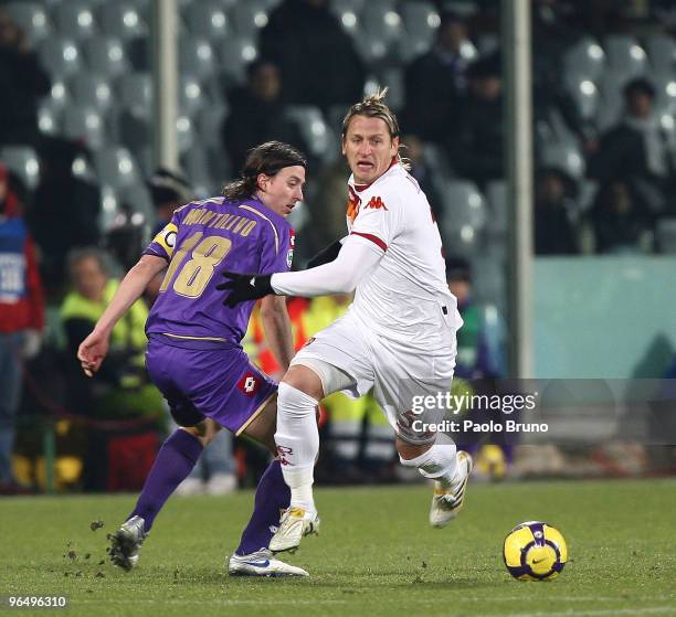 Philippe Mexes of AS Roma and Riccardo Montolivo of ACF Fiorentina in action during the Serie A match between Fiorentina and Roma at Stadio Artemio...