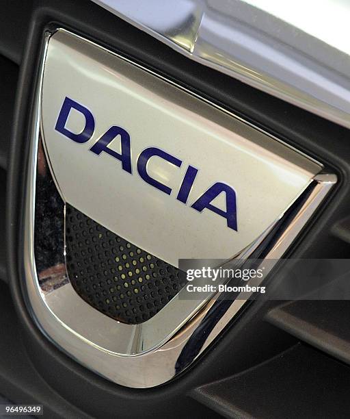 Dacia logo is seen on a Renault Logan automobile at a Renault SA showroom in Paris, France, on Monday, Feb. 8, 2010. Renault SA and Japanese...