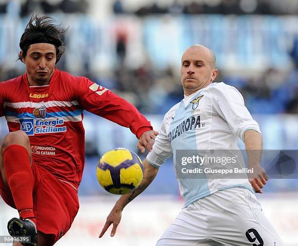 Pablo Alvarez of Catania and Tommaso Rocchi of Lazio in action during the Serie A match between Lazio and Catania at Stadio Olimpico on February 7,...