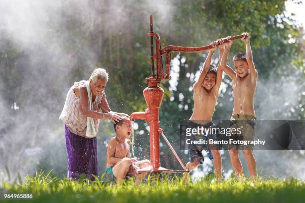 happiness of local life - waterpomp stockfoto's en -beelden