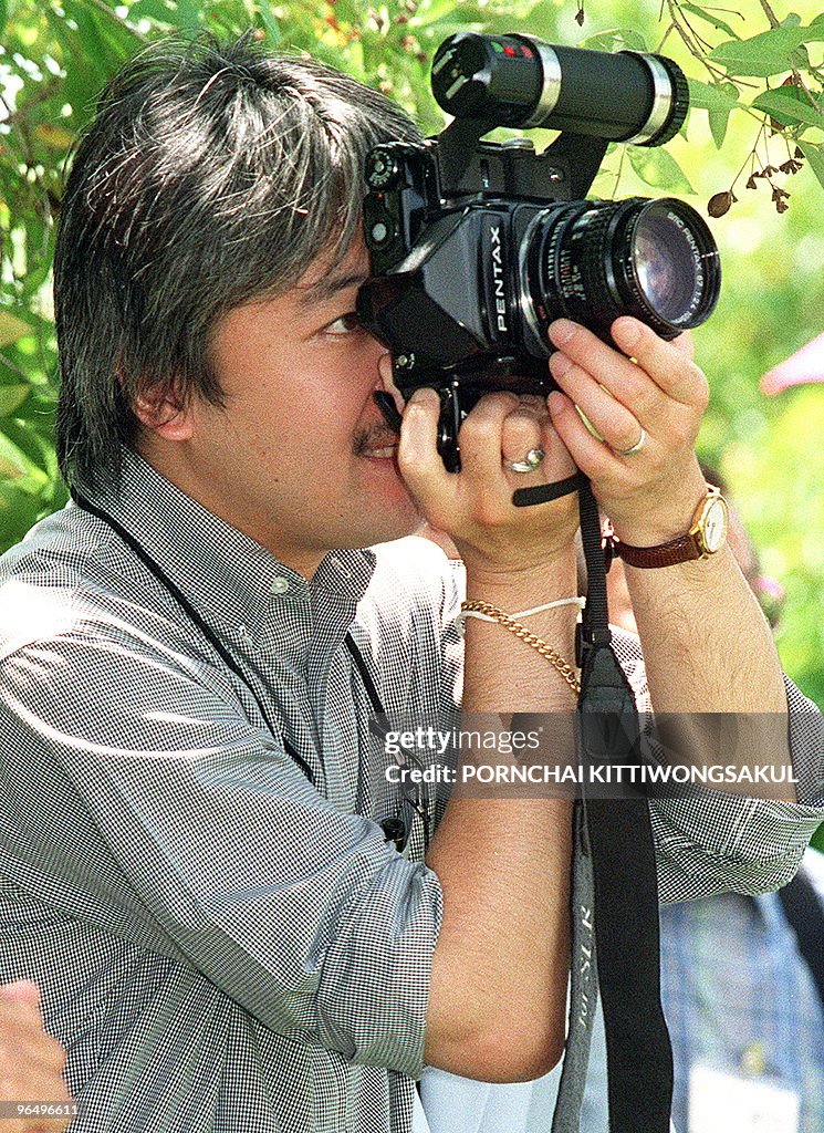 Japan's Prince Akishino takes a photo du