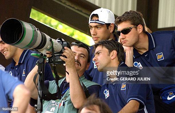 Italian national soccer team players Alessandro Nesta , Christian Vieri and Alessandro Costacurta look into an unidentified photographer's digital...