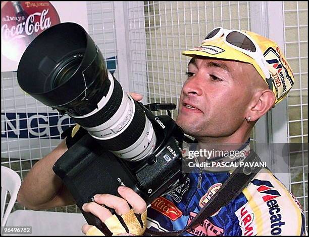 Italian cyclist Marco Pantani looks at a professional camera before the start of the eighth stage between Sauternes and Pau, south of France, 13 July.