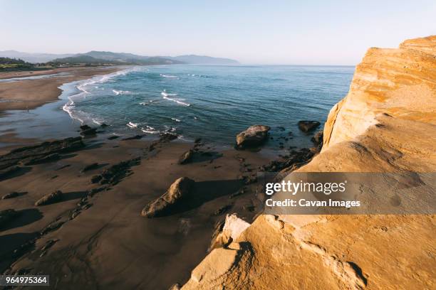 high angle tranquil view of sea against clear sky - tillamook rock light stock pictures, royalty-free photos & images