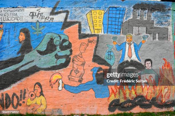 Mural painting and graffitis in the slum area "La Pincoya" in Santiago de Chile. Artists express their ideas about peace, disarmament, and the...