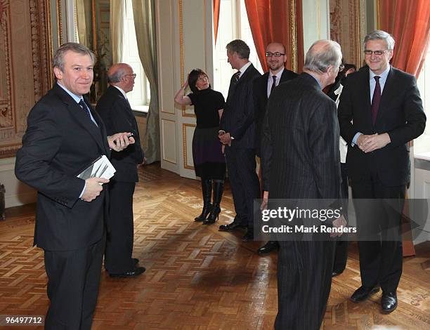 King Albert II of Belgium talks to Flemish Minister President Kris Peeters during a reception in honor of the aidworkers who helped in Haiti, at...