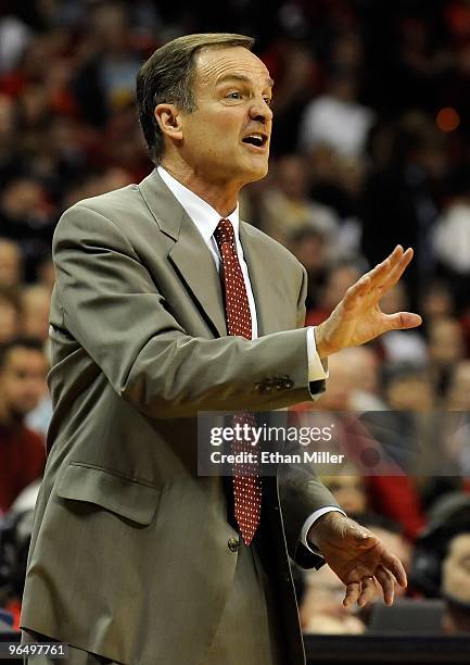 Head coach Lon Kruger of the UNLV Rebels signals to his players as they take on the Brigham Young University Cougars during the game at the Thomas &...