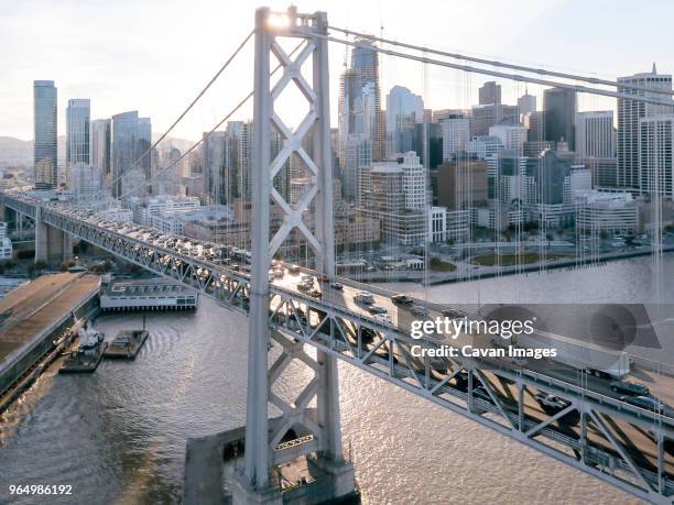 high angle view of cars moving on oakland bay bridge over sea against sky in city - oakland ストックフォトと画像