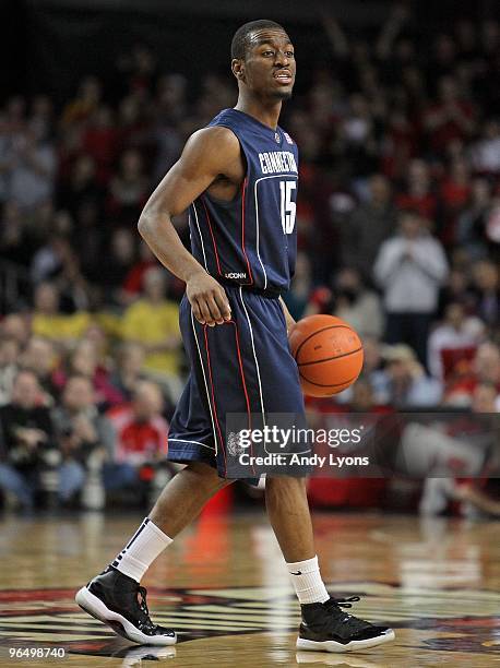 Kemba Walker of the Connecticut Huskies dribbles during the Big East Conference game against the Louisville Cardinals on February 1, 2010 at Freedom...