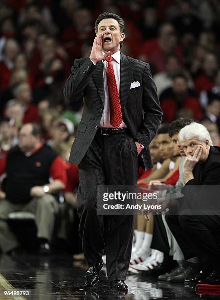 Rick Pitino the Head Coach of the Louisville Cardinals gives instructions to his team during the Big East Conference game against the Connecticut...