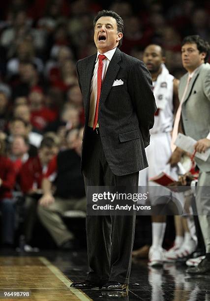 Rick Pitino the Head Coach of the Louisville Cardinals gives instructions to his team during the Big East Conference game against the Connecticut...
