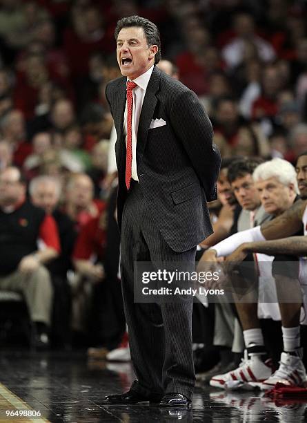 Rick Pitino the Head Coach of the Louisville Cardinals gives instructions to his team during the Big East Conference game against the Connecticut...