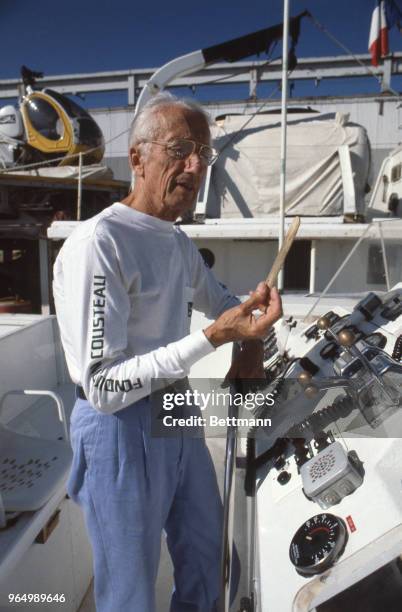 Jacques Cousteau, oceanographer, seen here aboard ship "Moulin a Vent>