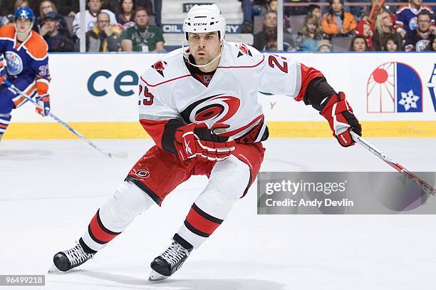 Tom Kostopoulos of the Carolina Hurricanes defends the zone against the Edmonton Oilers at Rexall Place on February 1, 2010 in Edmonton, Alberta,...