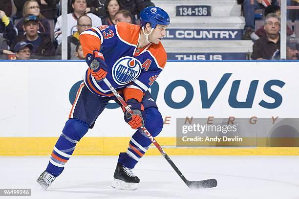 Jason Strudwick of the Edmonton Oilers carries the puck against the Carolina Hurricanes at Rexall Place on February 1, 2010 in Edmonton, Alberta,...