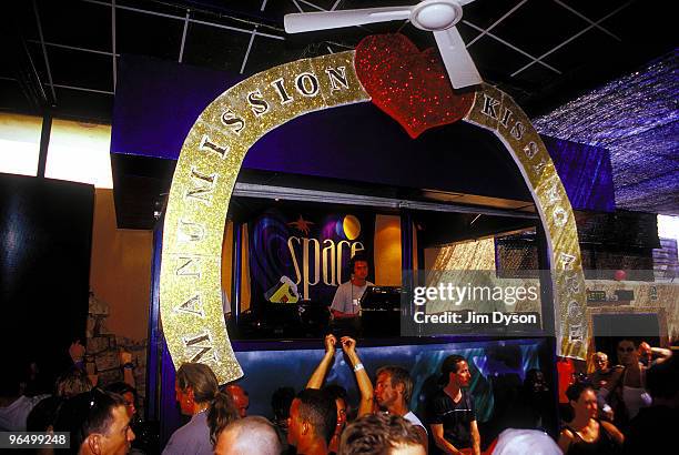 Clubbers enjoy the atmosphere during the after party of the opening night of the season for Manumission, on the terrace at Space in June 2001, in...