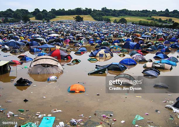 Flooded field is seen after a thunderous night of heavy rain during the first day of the Glastonbury Music Festival held at Worthy Farm on June 24,...