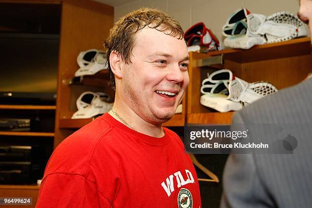 Goalie Anton Khudobin of the Minnesota Wild celebrates in the locker room after his first career victory against the Edmonton Oilers at the Xcel...