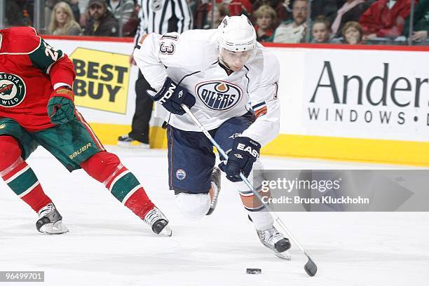 Andrew Cogliano of the Edmonton Oilers skates with the puck against the Minnesota Wild during the game at the Xcel Energy Center on February 4, 2010...