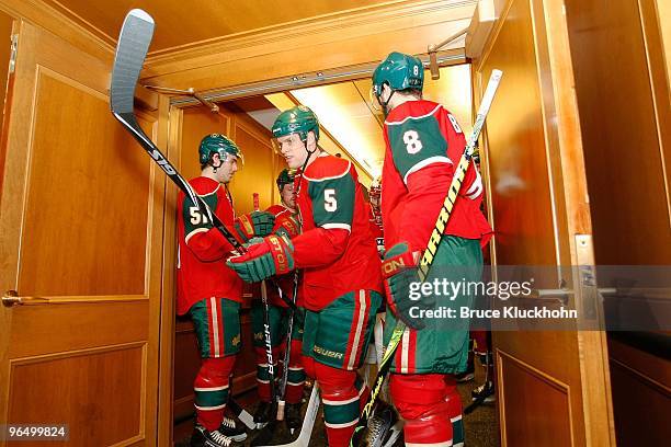 James Sheppard, Kim Johnsson, and Brent Burns of the Minnesota Wild get get ready prior to the game against the Edmonton Oilers at the Xcel Energy...