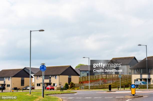 social housing on the outskirts of a scottish town - johnfscott stock pictures, royalty-free photos & images