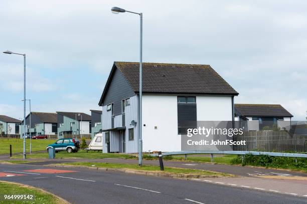 social housing on the outskirts of a scottish town - johnfscott stock pictures, royalty-free photos & images